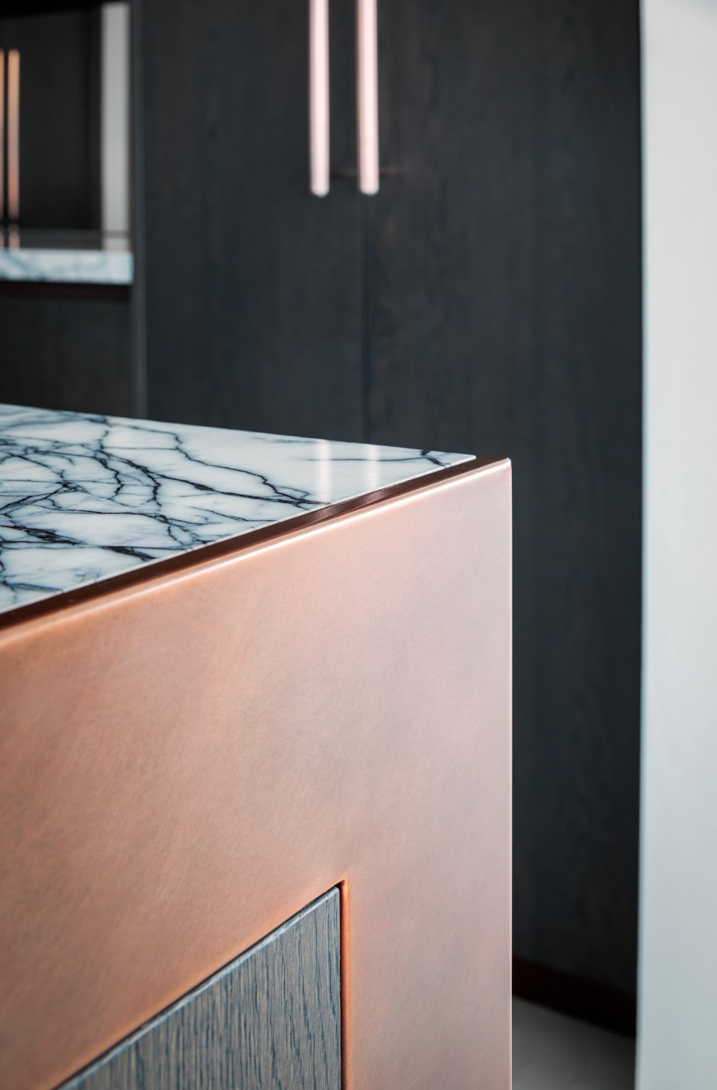 detail of copper counter with marble top