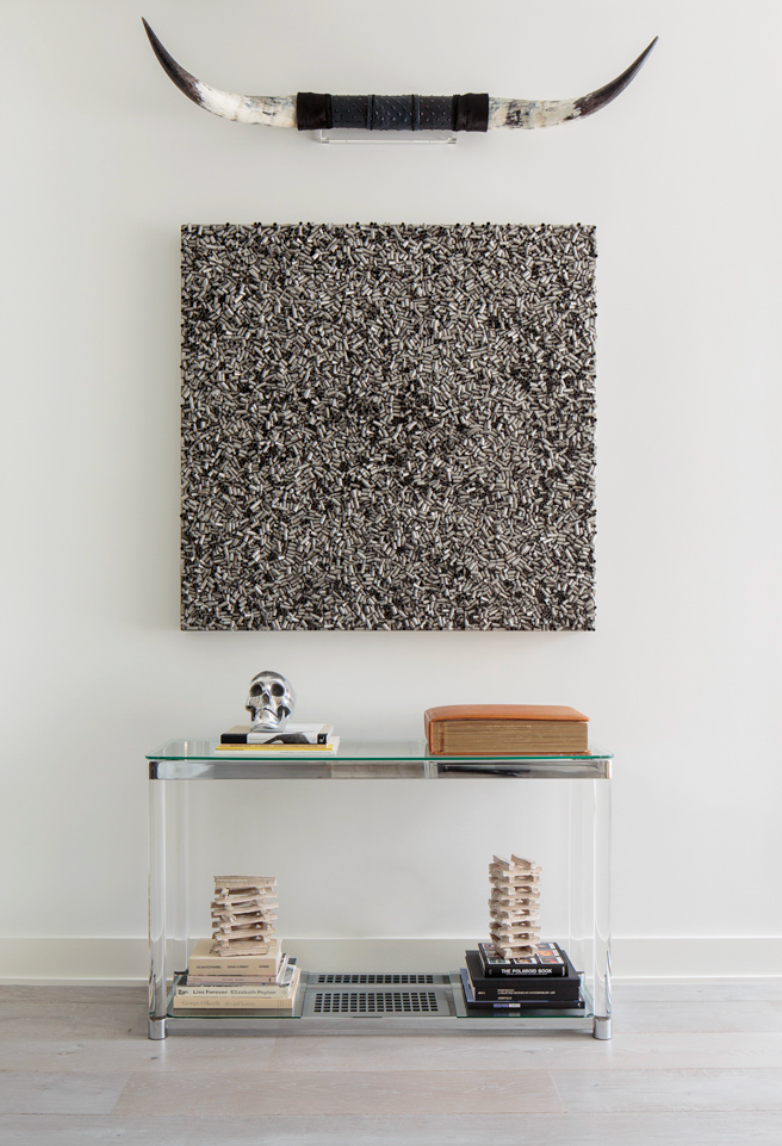 detail shot of console table with art and books