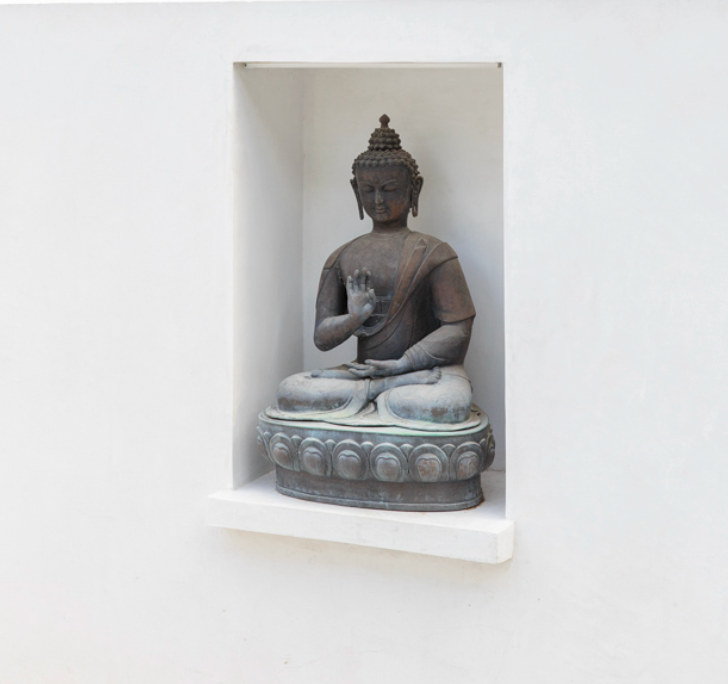 Serene buddha figure in a niche