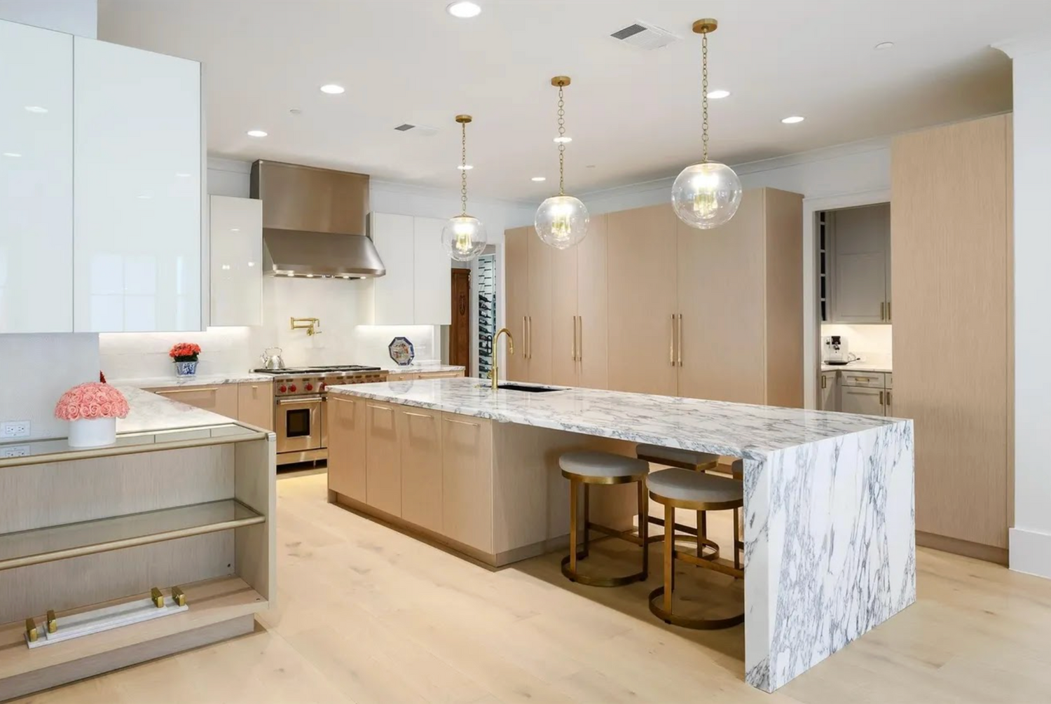Modern kitchen with marble island and stainless steel appliances