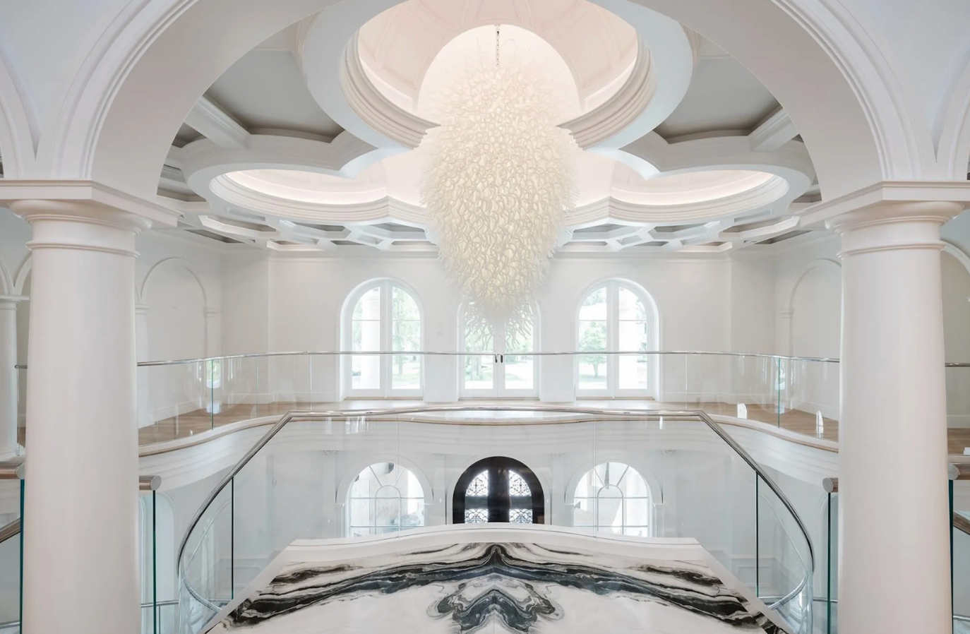 grand foyer with glass railing