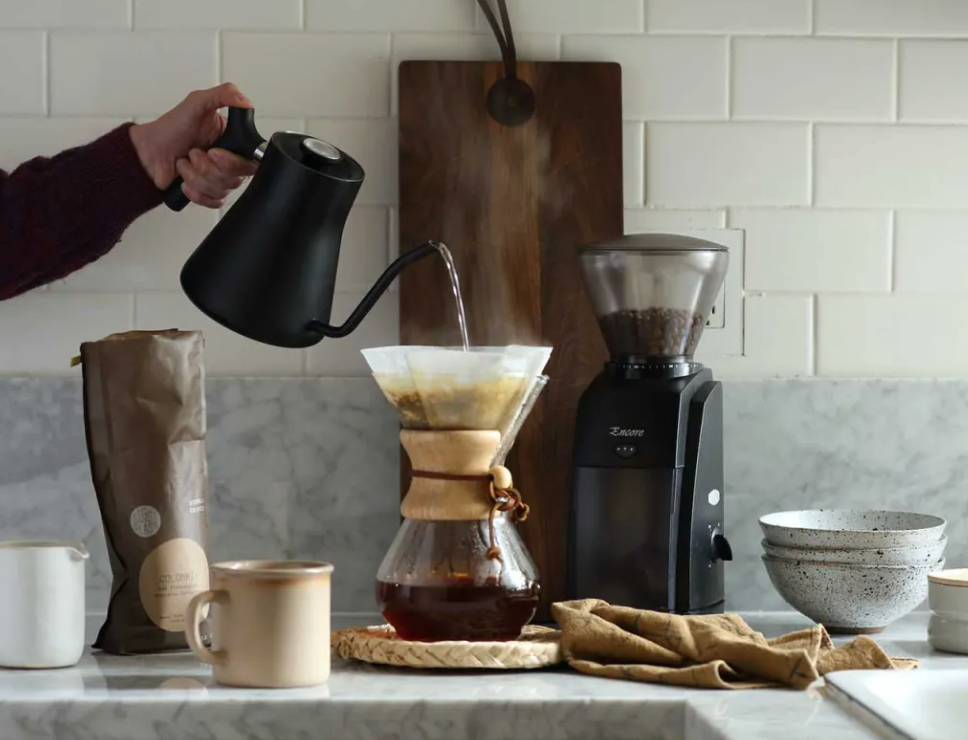 set up shot of someone making fresh press coffee
