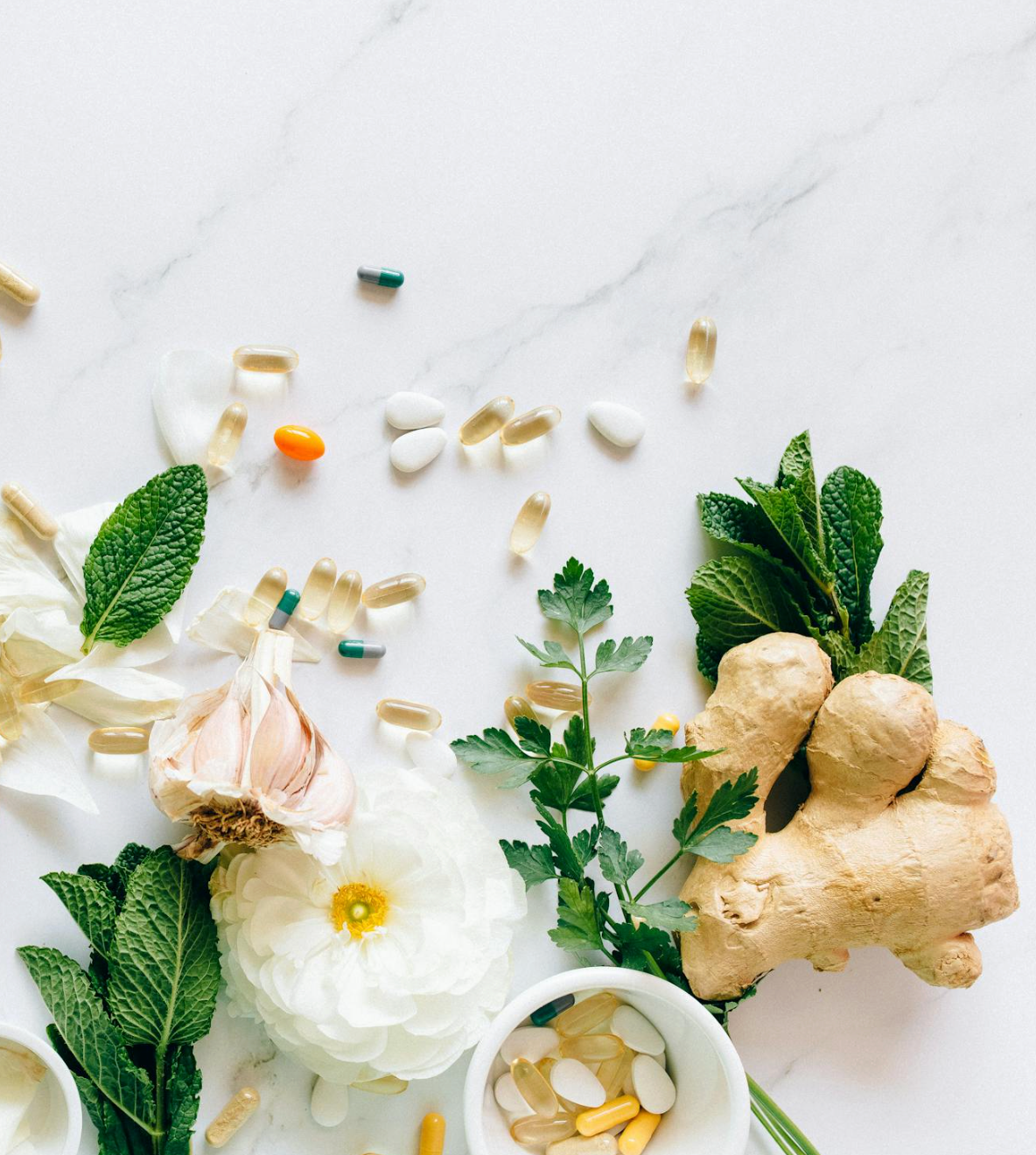 vitamins and supplements alongside natural ginger and herbs