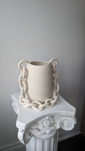 Handmade white ceramic vase with chain