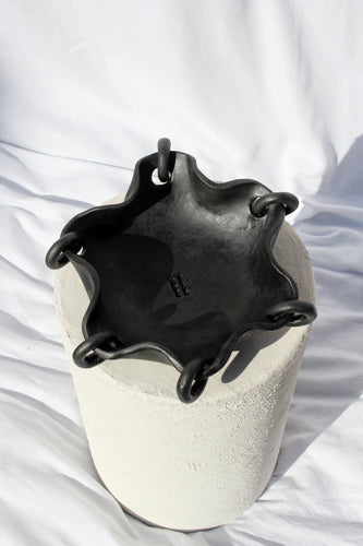 Decorative black ceramic tray with rings