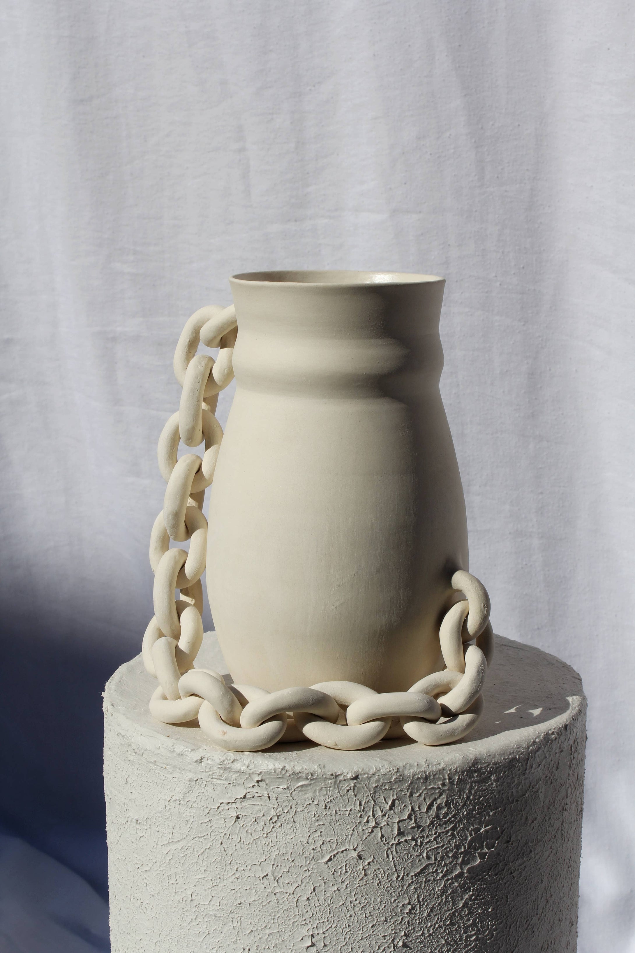 Handmade ceramic vase with chain