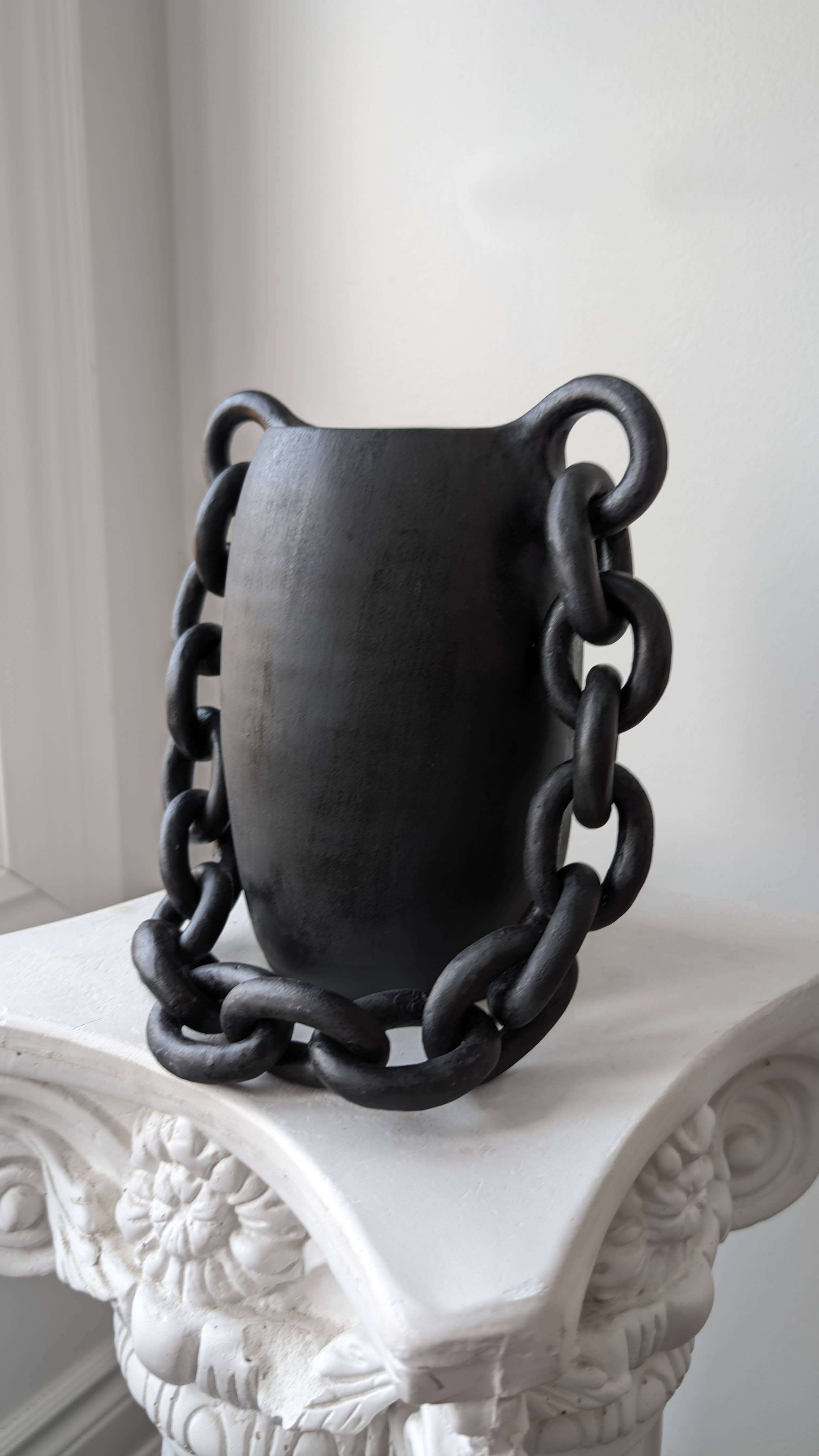 Handmade black ceramic vessel with chain