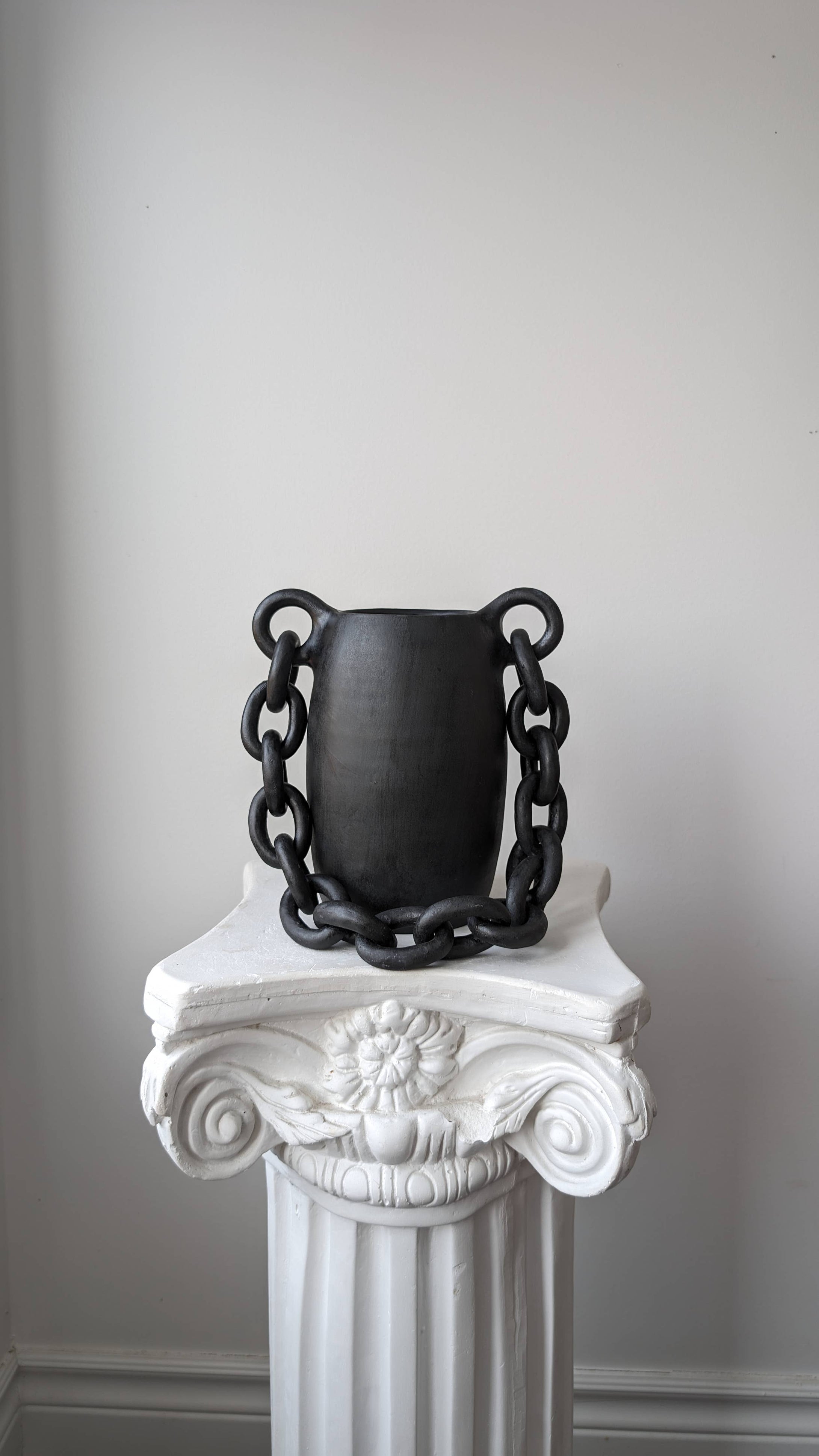 Handmade black ceramic vessel with chain