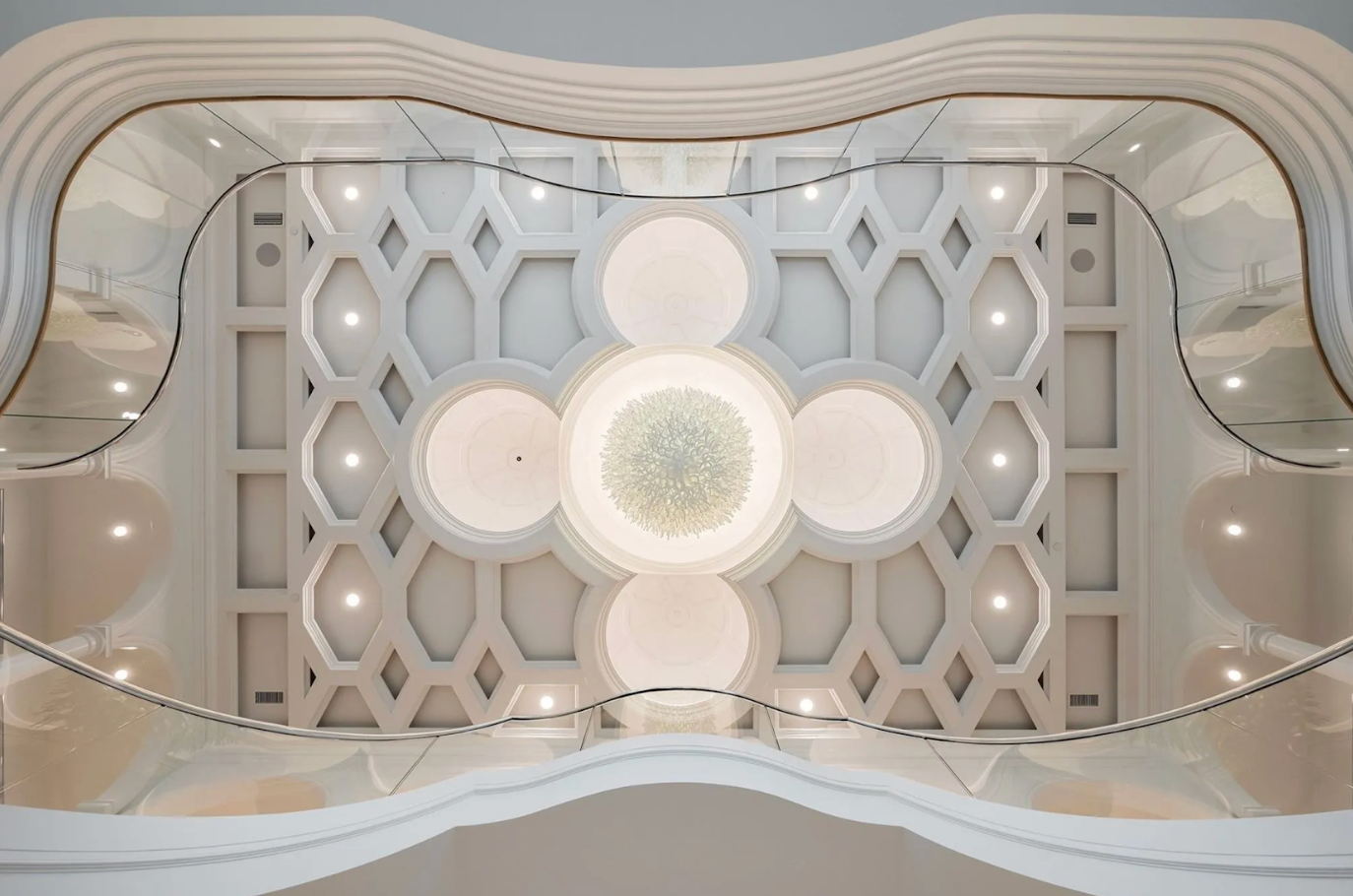 Decorative ceiling with geometric patterns and circular lights