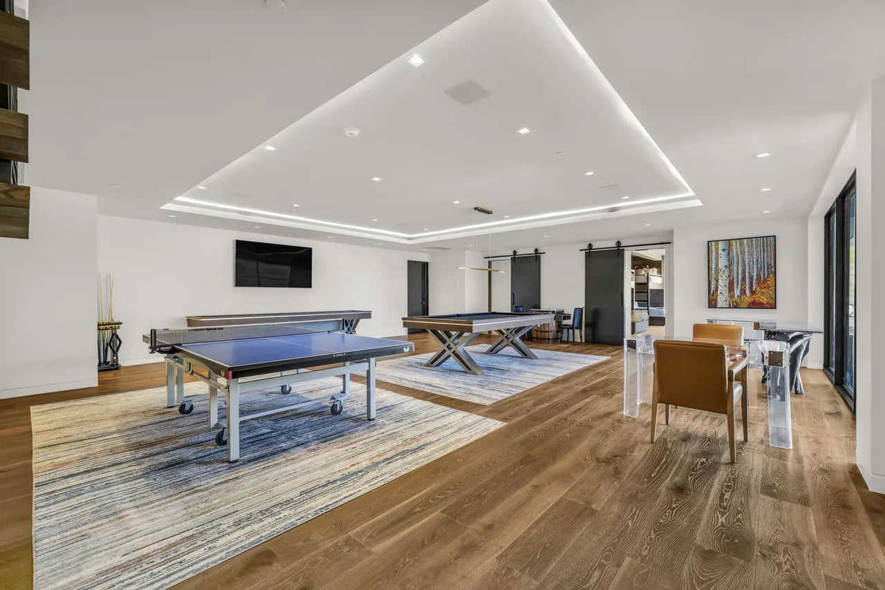 Modern room with pool tables, ping pong table and decorative elements